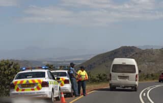 Police checkpoint on winding mountain road
