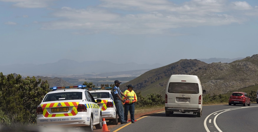 Police checkpoint on winding mountain road