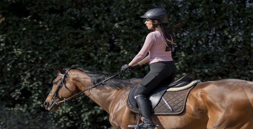 A woman rides a horse confidently—Can I Get a DUI While Riding a Horse? DUI Law Firm Denver breaks down what Colorado law really says.