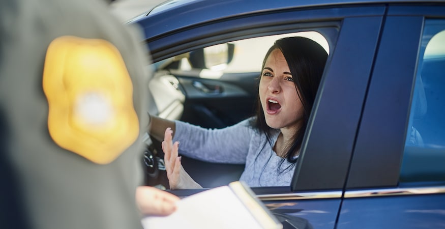 Can You Beat a Colorado DUI on Your Own Using Your Own Evidence Woman arguing with police officer through car window