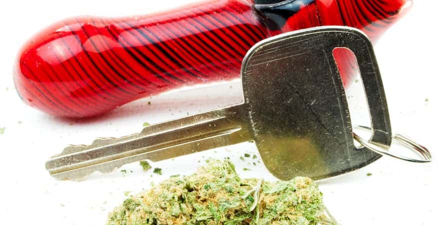 Glass pipe, car key, and cannabis