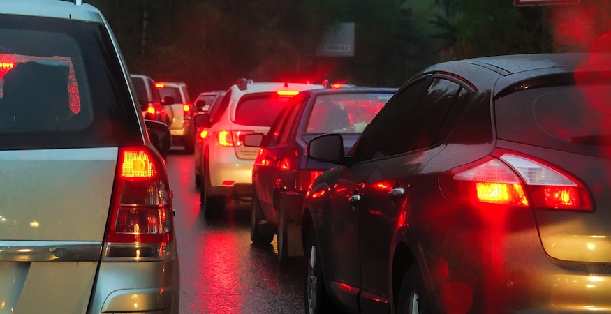Cars in traffic jam with glowing brake lights