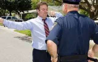 Understanding field sobriety tests in Colorado, showing an officer conducting a roadside sobriety test on a man outdoors, highlighting balance, coordination, eye movement, and behavioral cues officers use to assess impairment.